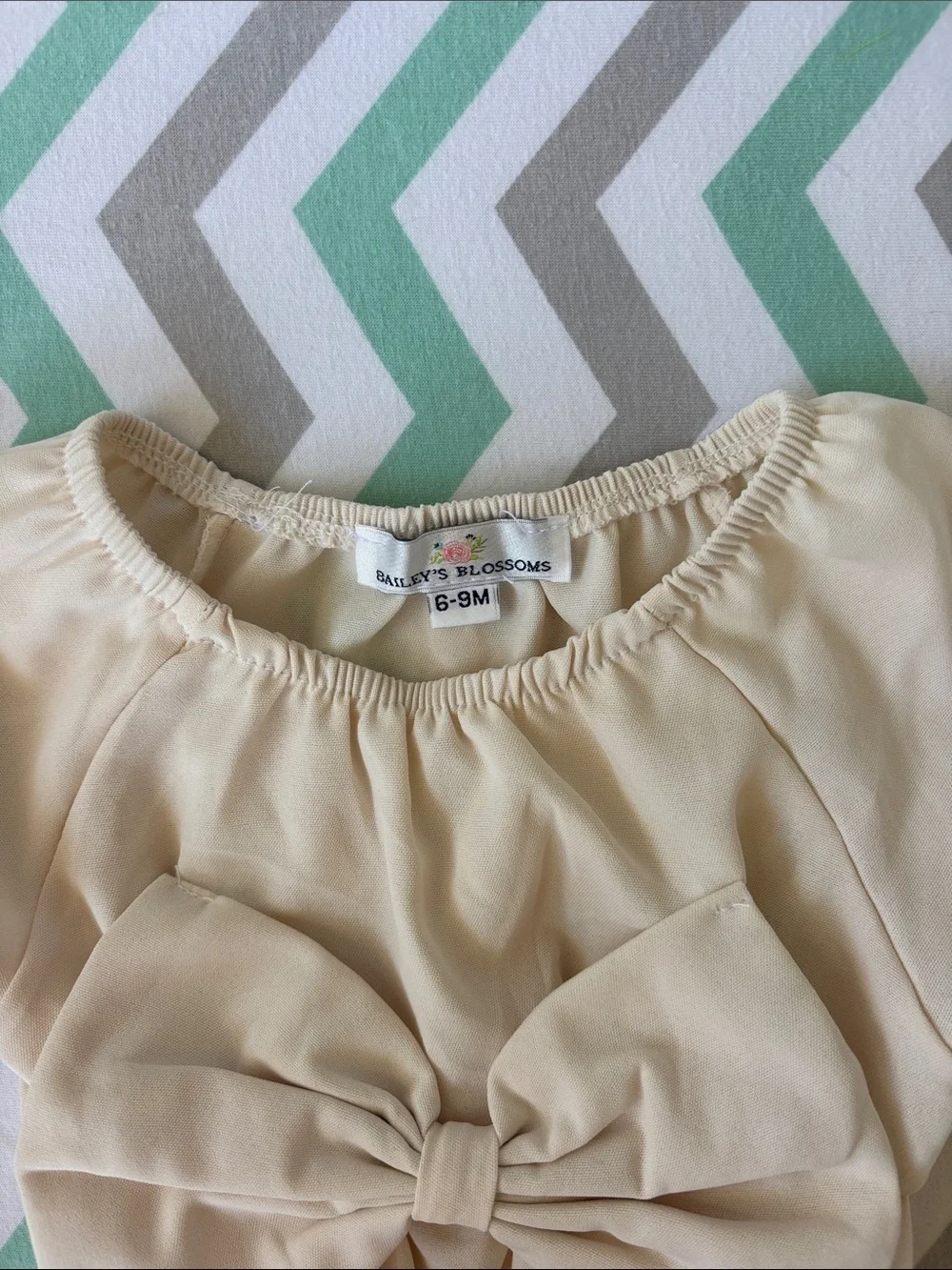 Cream Bow-Front Baby One-Piece Bodysuit